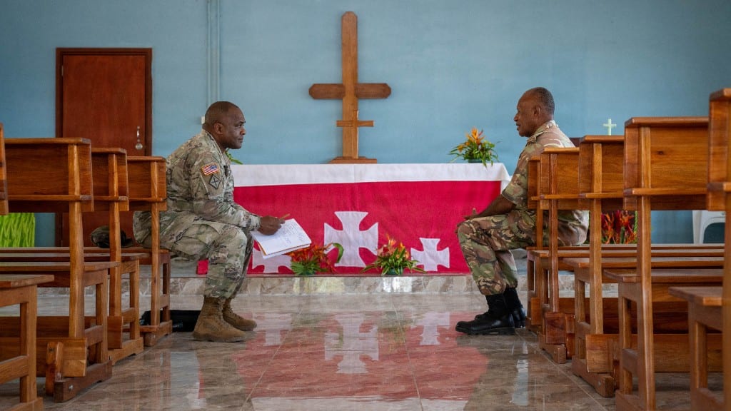 U.S. Army Chaplain Maj. Josiah Burns Sr. talks with Chaplain Benstead Bareta from the Papua New Guinea Defence Force during Tamiok Strike 26 in Port Moresby, Papua New Guinea