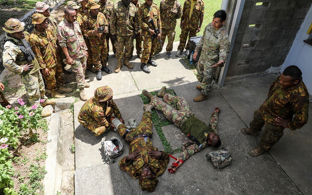Military personnel conducting tactical combat casualty care training